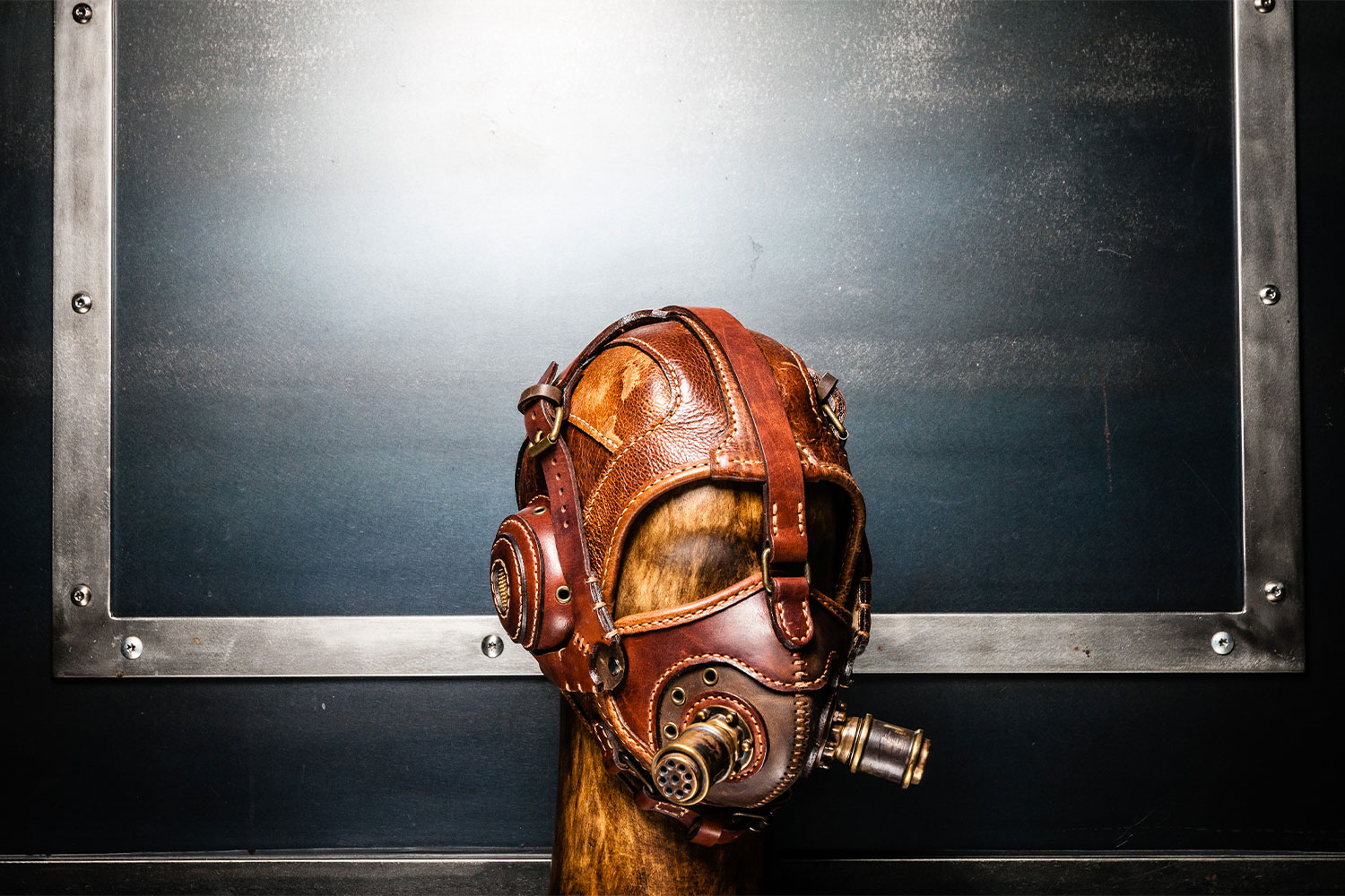 Hand-stitched leather aviator helmet with brass-filtered respirator by Vasile & Pavel Vasilache